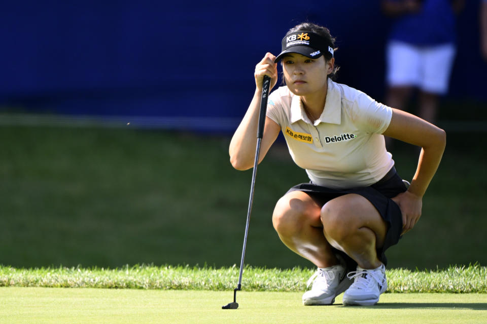 In Gee Chun, of South Korea, lines up her putt on the 17th green during the third round in the Women's PGA Championship golf tournament at Congressional Country Club, Saturday, June 25, 2022, in Bethesda, Md. (AP Photo/Terrance Williams)