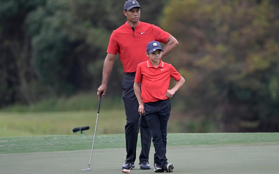 Tiger Woods and his son Charlie - Tiger Woods poised to make competitive return to golf – just 10 months after life-threatening car crash - AP