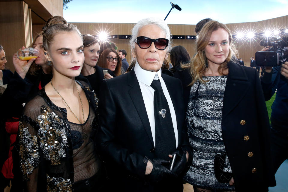 Cara Delevigne, Karl Lagerfeld and Diane Kruger.<em> (Photo via Getty Images)</em>