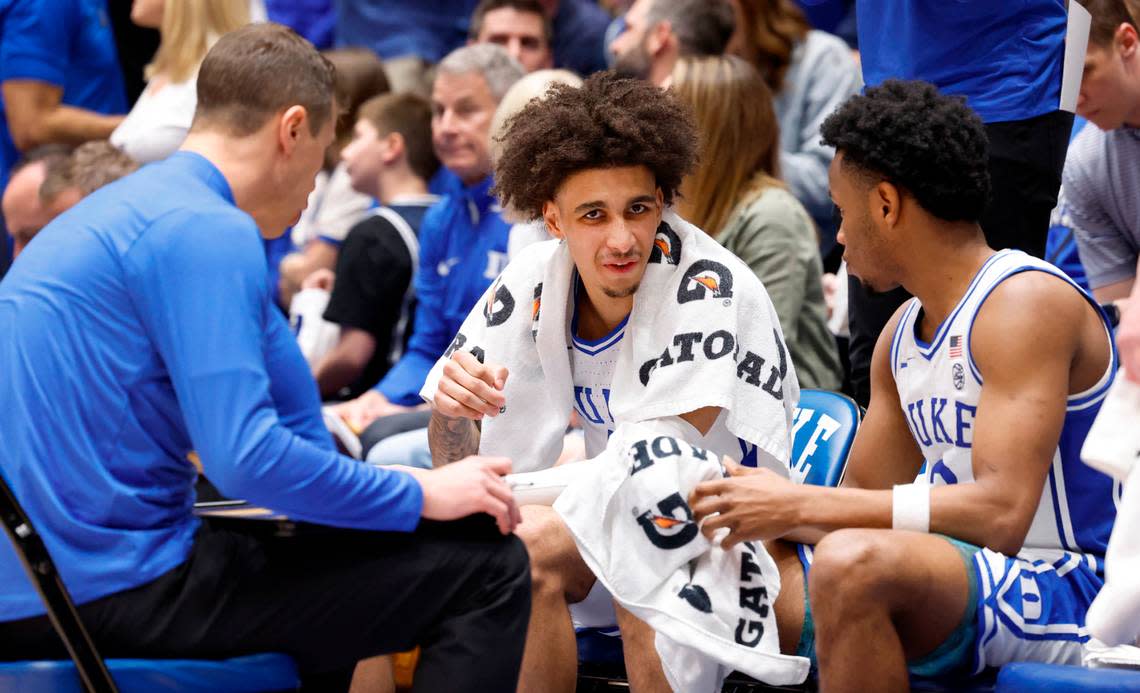 Duke’s Tyrese Proctor (5) talks with Jeremy Roach (3) and head coach Jon Scheyer before the start of the second half of Duke’s 80-65 victory over Boston College at Cameron Indoor Stadium in Durham, N.C., Saturday, Feb. 10, 2024.