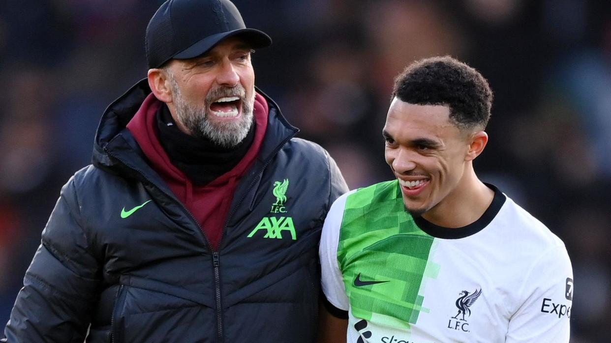 Jurgen Klopp hugs Trent Alexander-Arnold