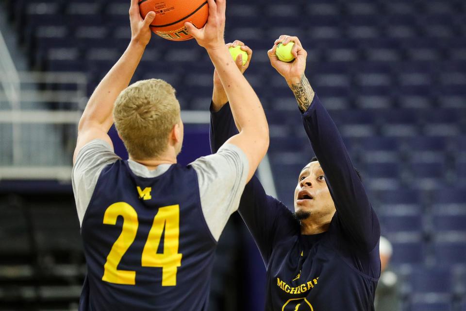 Michigan forward Youssef Khayat practices with guard Jaelin Llewellyn during media day at Crisler Center in Ann Arbor on Tuesday, Oct. 17, 2023.