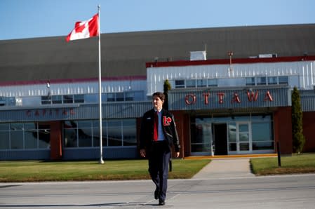 Liberal leader and Canadian Prime Minister Justin Trudeau walks on the tarmac at the airport during an election campaign visit to Ottawa,