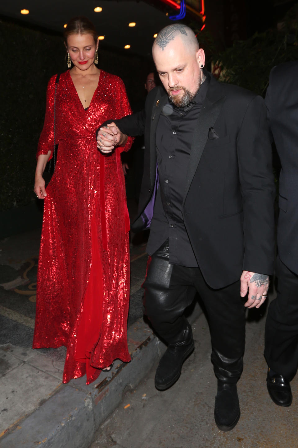 The newly retired Cameron Diaz and husband Benji Madden arriving for Gwyneth Paltrow and Brad Falchuk’s engagement party on April 14. (Photo: Splash News)