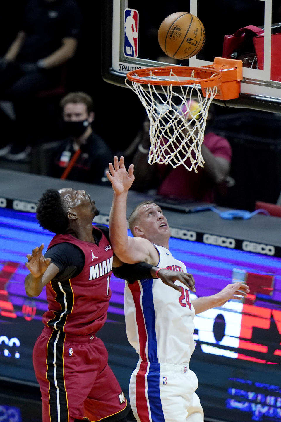 Miami Heat center Bam Adebayo, left, shoots over Detroit Pistons center Mason Plumlee (24) during the first half of an NBA basketball game, Saturday, Jan. 16, 2021, in Miami. (AP Photo/Lynne Sladky)