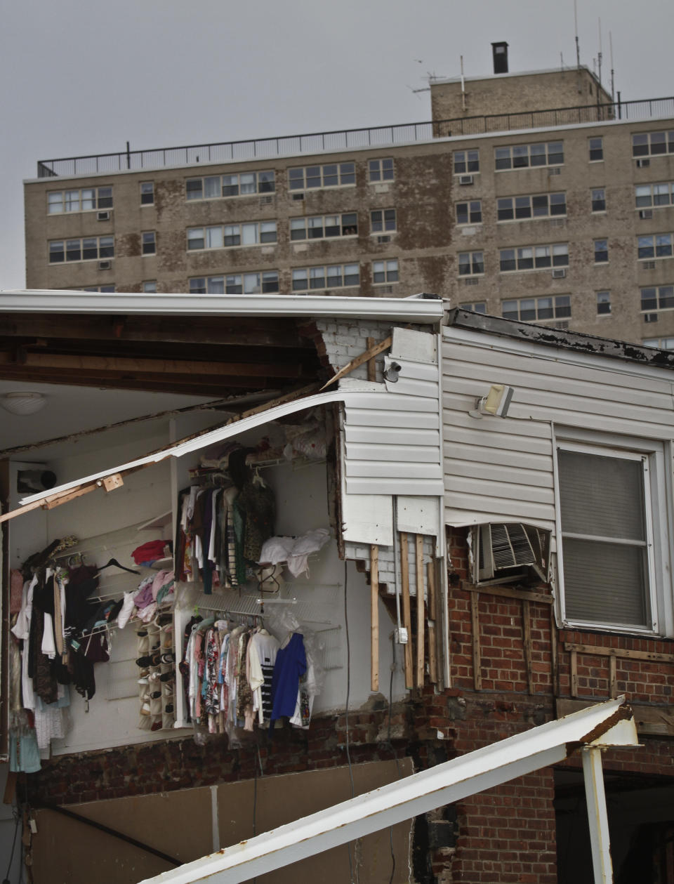 A second floor closet is exposed in a beachfront house in the aftermath of a storm surge from Hurricane Sandy, Tuesday, Oct. 30, 2012, in Coney Island's Sea Gate community in New York. (AP Photo/Bebeto Matthews)