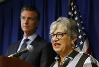 California Air Resources Board Chair Mary Nichols, flanked by Gov. Gavin Newsom, left, discusses the Trump administration's pledge to revoke California's authority to set vehicle emissions standards that are different than the federal standards, during a news conference in Sacramento, Calif., Wednesday, Sept. 18, 2019. (AP Photo/Rich Pedroncelli)
