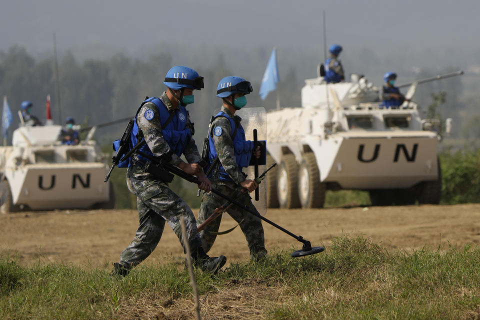 Chinese United Nations troop practice sweeping for mines during the Shared Destiny 2021 drill at the Queshan Peacekeeping Operation training base in Queshan County in central China's Henan province Wednesday, Sept. 15, 2021. Peacekeeping troops from China, Thailand, Mongolia and Pakistan took part in the 10 days long exercise that field reconnaissance, armed escort, response to terrorist attacks, medical evacuation and epidemic control. (AP Photo/Ng Han Guan)