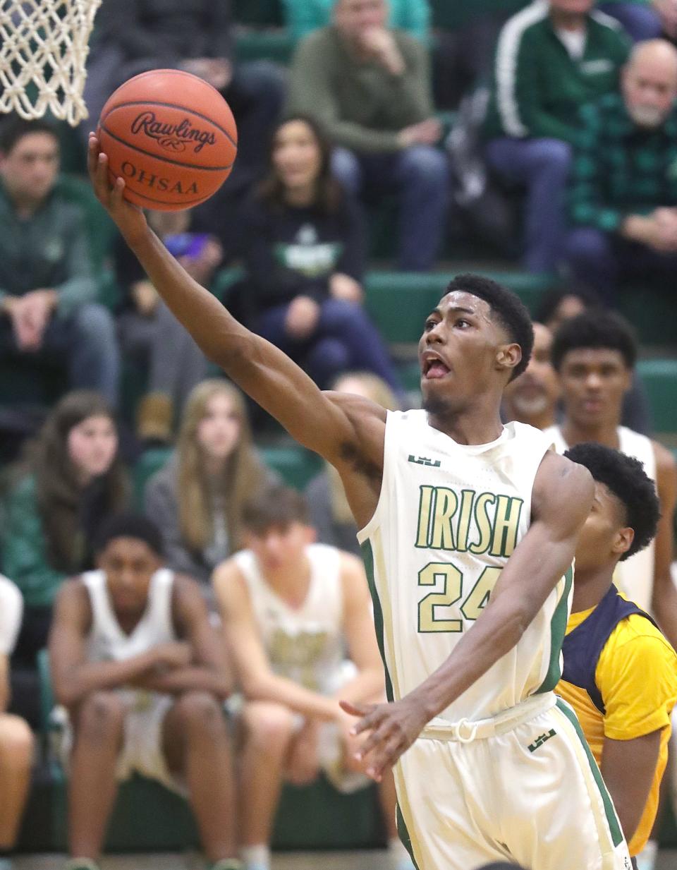 St. Vincent-St. Mary's Sencire Harris drives to the basket against St. Ignatius on Thursday, Jan. 27, 2022 in Akron, Ohio at LeBron James Arena. The Irish won the game 56-38.
