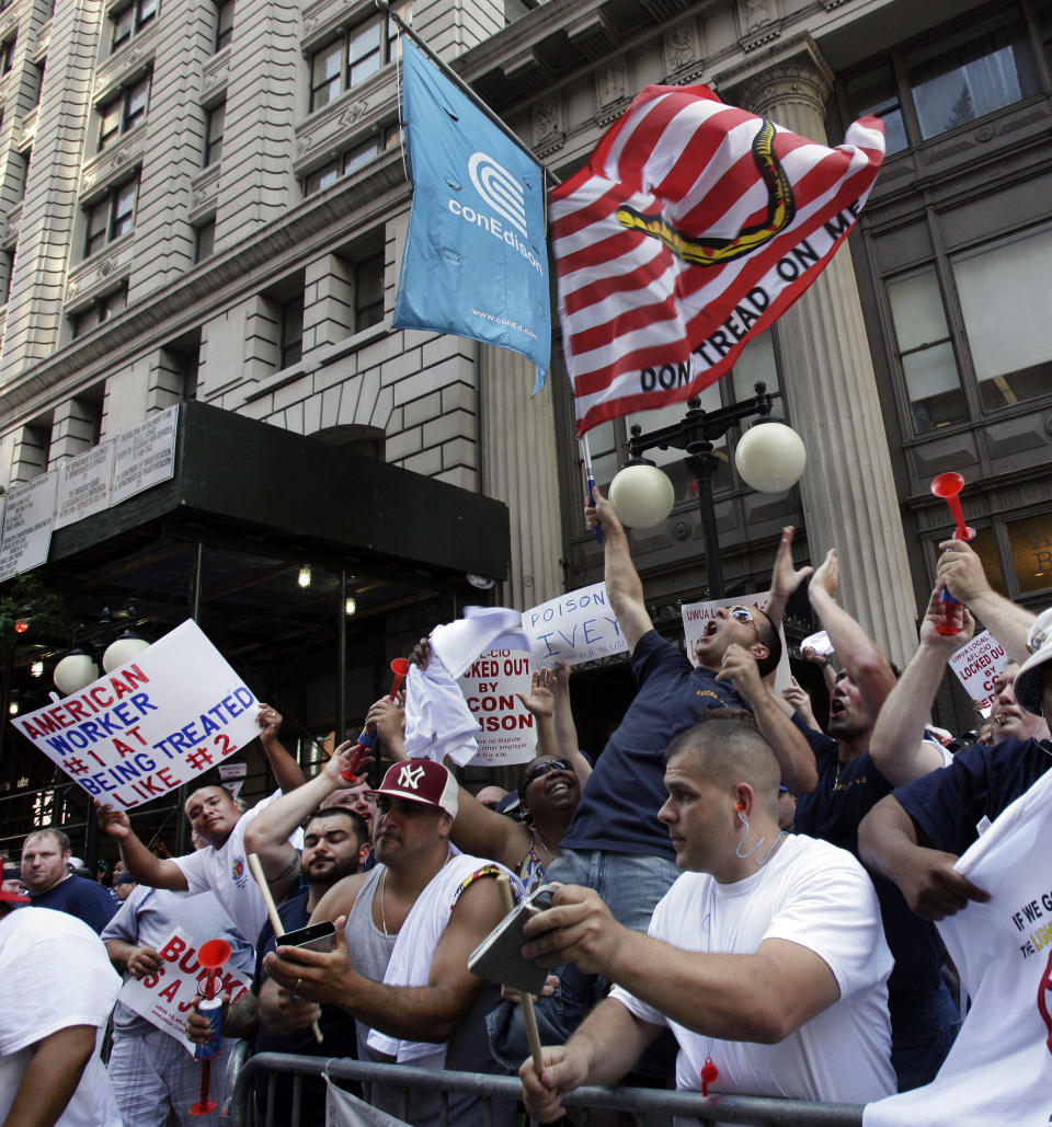 Locked-out workers demonstrate outside Consolidated Edison headquarters, in New York, Thursday, July 5, 2012. Consolidated Edison and the union representing its employees are returning to the bargaining table. Talks were scheduled to resume Thursday afternoon, while the picket lines in New York's Union Square grow. Pressure is mounting on both sides to resume negotiations after they failed last weekend. On Thursday, the company put out a full page ad blasting the union. (AP Photo/Richard Drew)