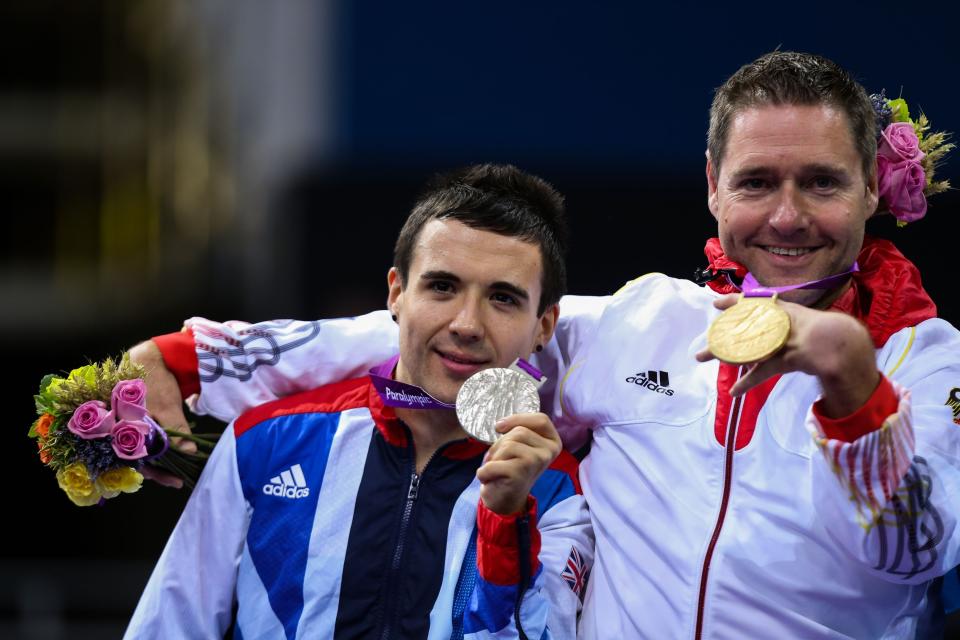 Great Britain's Will Bayley (left) holds his silver medal next to Germany's gold medal winner Jochem Wollmert in the men's single's class 7 gold medal match at the Excel Arena