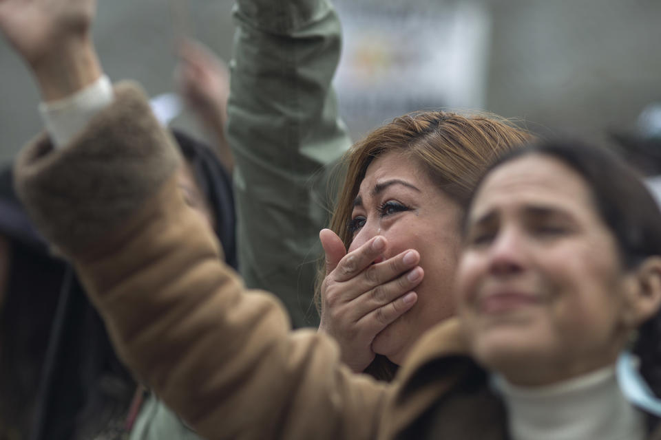 Vanessa Chairee cries as women call up toward immigrants detained at the Federal Bureau of Prisons Metropolitan Detention Center during the International Women's Day March and Rally on March 5, 2017, in Los Angeles.