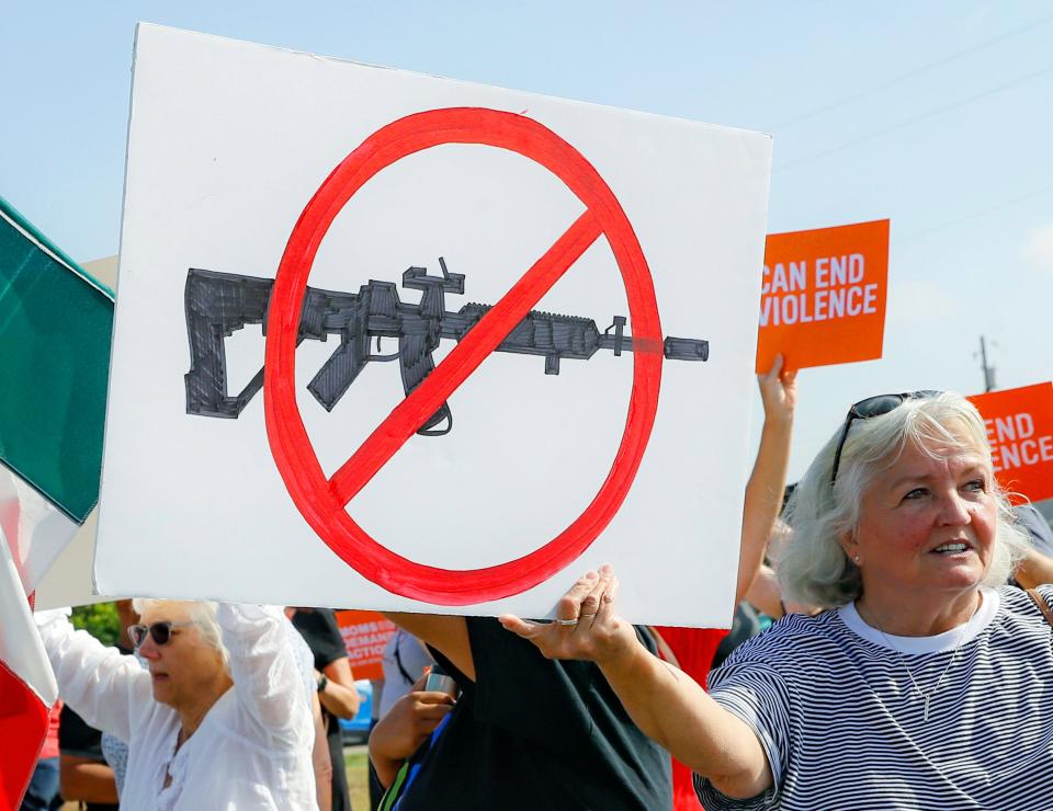 Demonstrators demanded stricter gun-control measures in Dayton, Ohio, days after nine people died in a shooting there.