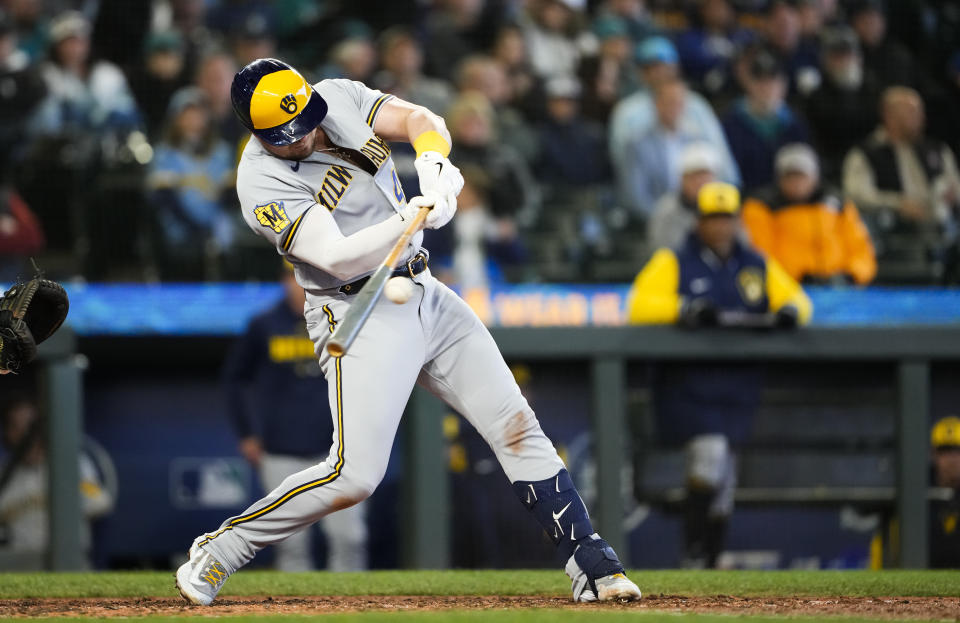 Milwaukee Brewers' Luke Voit hits an RBI single against the Seattle Mariners during the seventh inning of a baseball game Wednesday, April 19, 2023, in Seattle. (AP Photo/Lindsey Wasson)