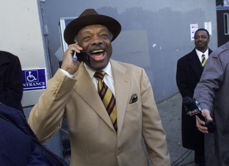 BROWN VOTE 5-C-14DEC99-MN-MAC Election Day Mayor Willie Brown places after casting his early morning vote, all smiles as he stops outside the voting place to conduct an on the air interview with a local radio station. by Michael Macor/The Chronicle (Photo By MICHAEL MACOR/The San Francisco Chronicle via Getty Images)