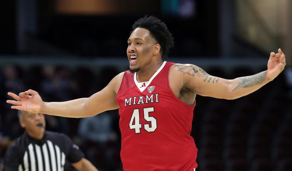 Miami (OH) Redhawks center Anderson Mirambeaux (45) celebrates after knocking down a three against the Akron Zips during the first half of an NCAA college basketball game in the quarterfinals of the Mid-American Conference Tournament at Rocket Mortgage FieldHouse, Thursday, March 14, 2024, in Cleveland, Ohio.