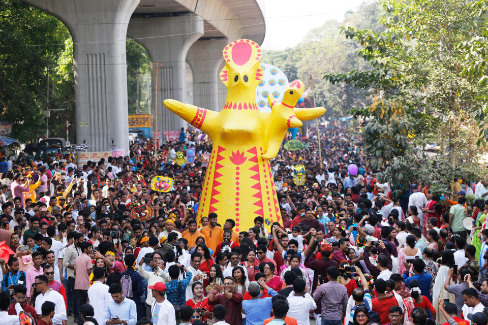 People participate in a rally to celebrate Bengali New Year or Pohela Boishakh in Dhaka, Bangladesh, on April 14, 2023. 