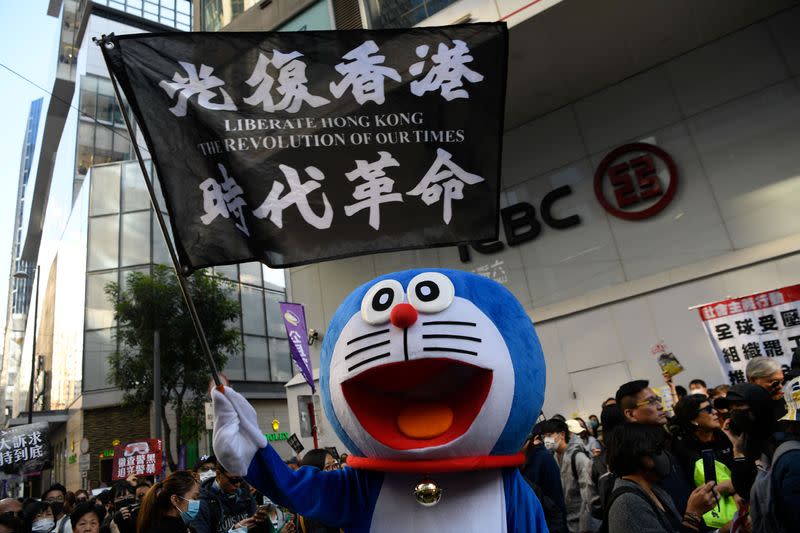 People attend a Human Rights Day march