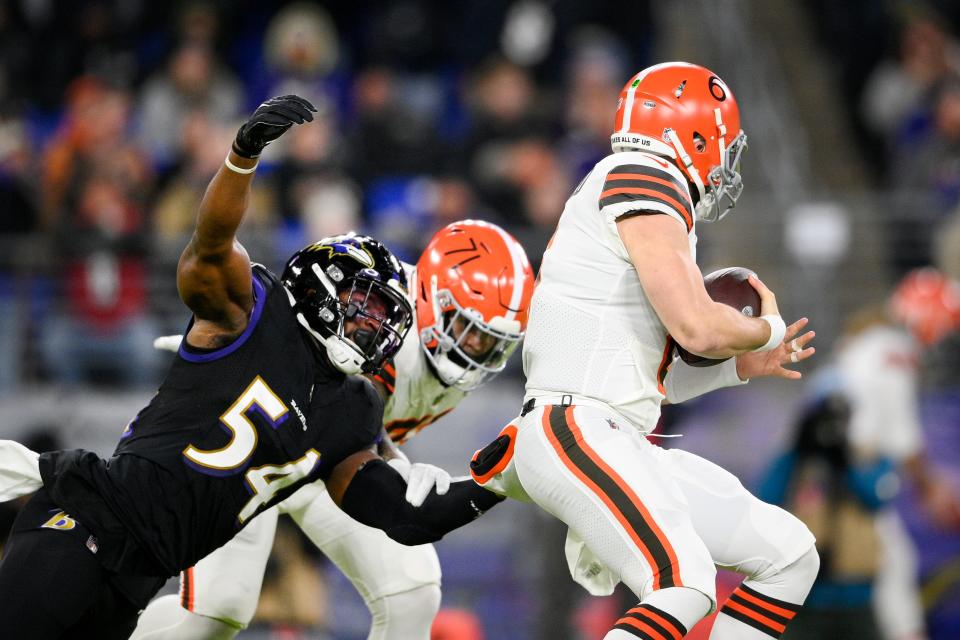 Baltimore Ravens outside linebacker Tyus Bowser (54) is blocked by Cleveland Browns offensive tackle Jedrick Wills (71) as quarterback Baker Mayfield (6) avoids the sack during the first half of an NFL football game, Sunday, Nov. 28, 2021, in Baltimore. (AP Photo/Nick Wass)