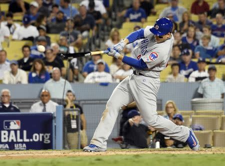 Oct 19, 2016; Los Angeles, CA, USA; Chicago Cubs first baseman Anthony Rizzo hits a single against the Los Angeles Dodgers in the 8th inning during game four of the 2016 NLCS playoff baseball series at Dodger Stadium. Mandatory Credit: Richard Mackson-USA TODAY Sports