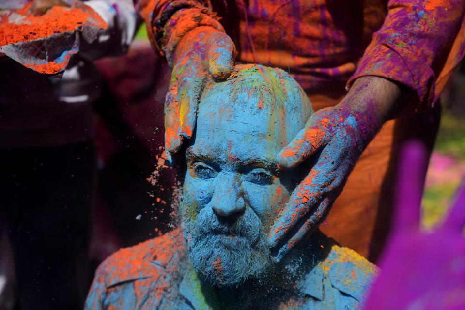 Indians smear colored powder on each other as they celebrate Holi in Jammu, India, Monday, March.25, 2024.The Hindu festival of colors, also heralds the arrival of spring.(AP Photo/Channi Anand)