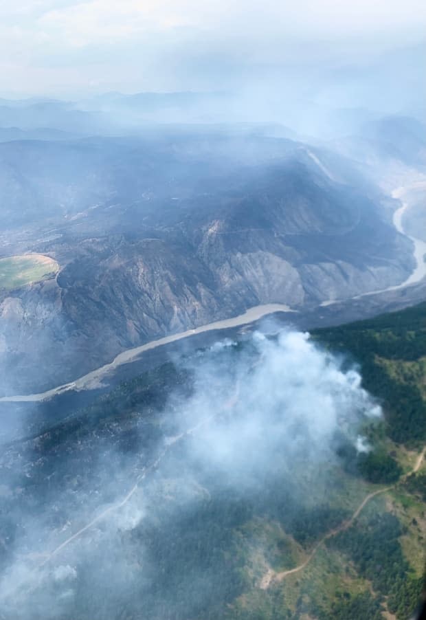 A wildfire burns in McKay Creek on Monday. As most of B.C.'s southern Interior sees smoky skies, experts are warning that residents throughout the province should be prepared. (Twitter/B.C. Wildfire Service - image credit)