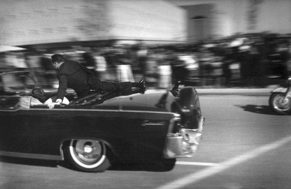 The limousine carrying mortally wounded President John F. Kennedy races toward the hospital seconds after he was shot in Dallas on Nov. 22, 1963. Secret Service agent Clinton Hill is riding on the back of the car, Nellie Connally, wife of Texas Gov. John Connally, bends over her wounded husband, and first lady Jacqueline Kennedy leans over the president. The National Archives has until Oct. 26, 2017, to disclose the remaining files related to Kennedy’s assassination, unless President Donald Trump intervenes. (Photo: Justin Newman/AP)