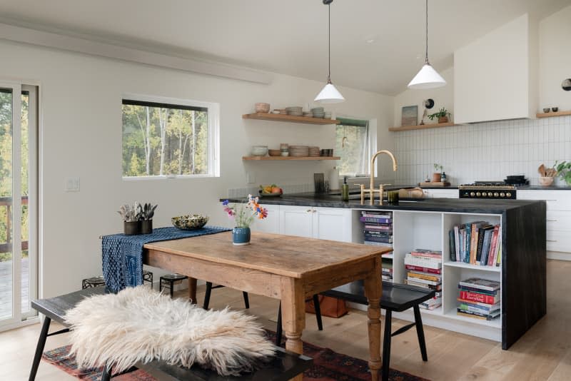 Vintage wooden dining table in natural light filled home.