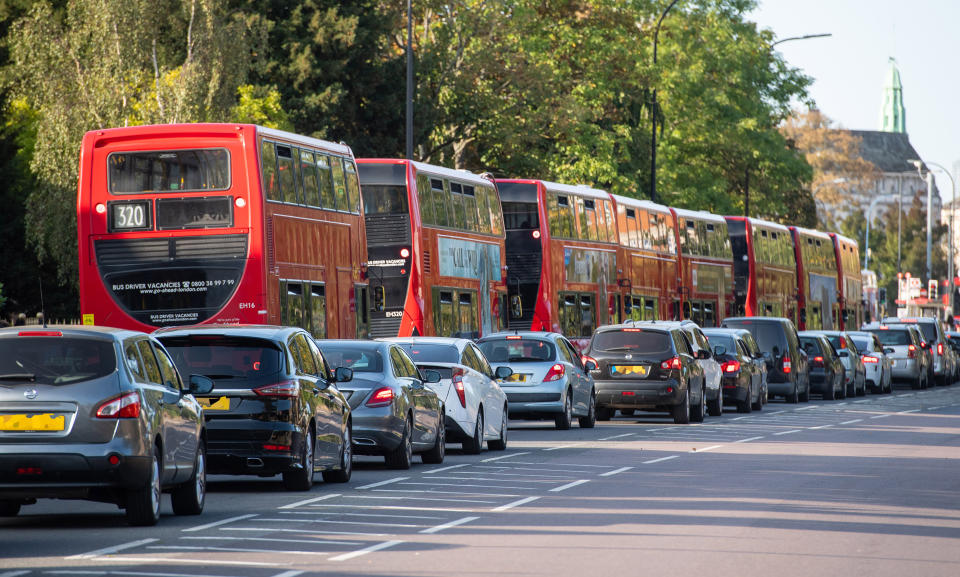 IMAGE PIXELLATED BY PA PICTURE DESK Queuing cars on the approach to a drive through test centre in Lewisham, south London.