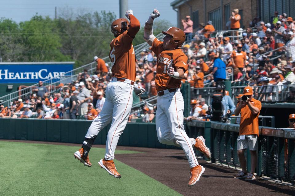 Rylan Galvan (6) and Peyton Powell (15) celebrate a home run during a game against the Texas Tech Raiders on Sunday March 26, 2023.