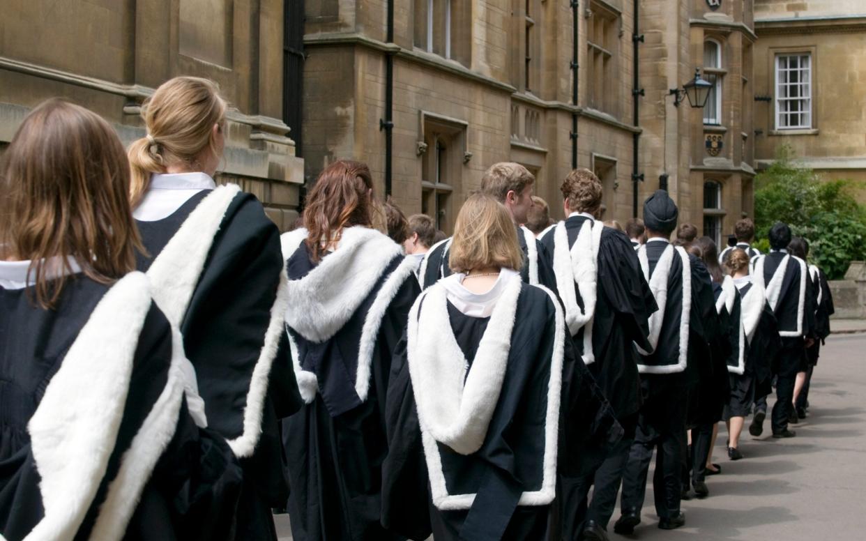 Cambridge University students from Clare College dressed in their graduation gowns  - iStock Unreleased 