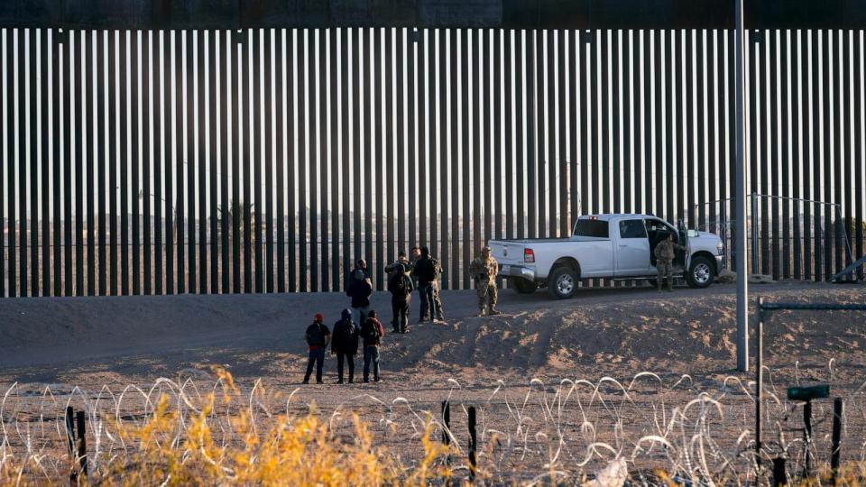 PHOTO: Texas National Guard members direct a group of migrants to Border Patrol after crossing the US-Mexico border in Ciudad Juarez, Chihuahua state, Mexico, Feb. 8, 2024. (Justin Hamel/Bloomberg via Getty Images)