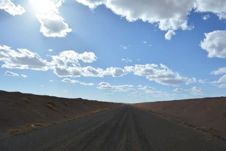 A general view shows a part of half-paved road that spans 225 kilometers from the Ukhaa Khudag and Tavan Tolgoi coal mines to the China-Mongolia border, in Tsogttsetsii, Mongolia, June 12, 2017. REUTERS/Terrence Edwards