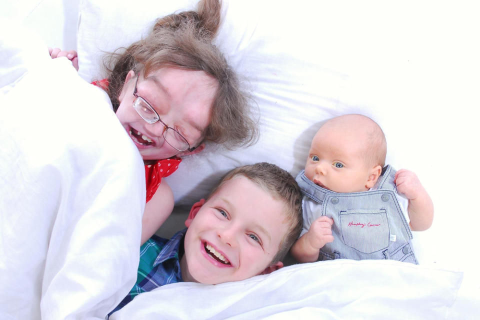 Lizzy laughing with her siblings when they were younger (Collect/PA Real Life)