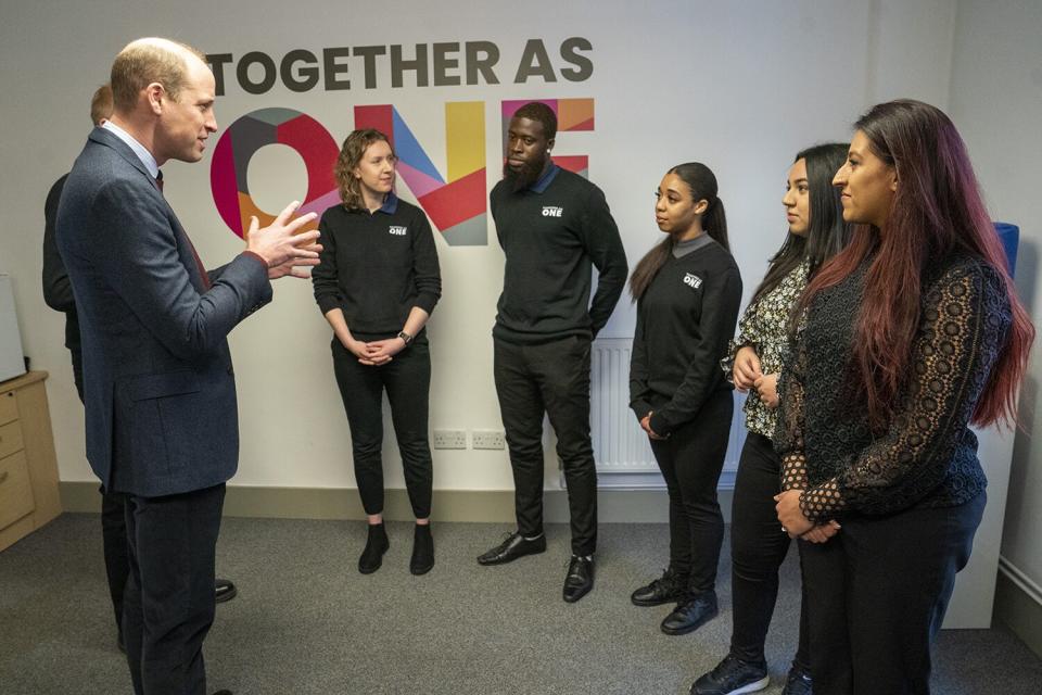 Prince William, Prince of Wales (left) during his visit to "All together" January 17, 2023 in Slough, England