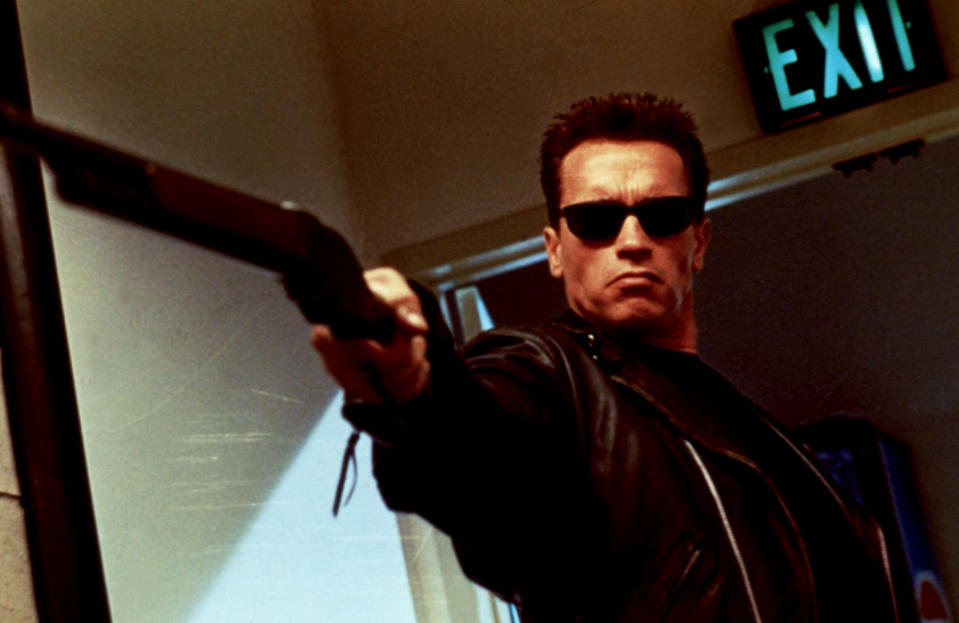 Arnold Schwarzenegger holding a gun