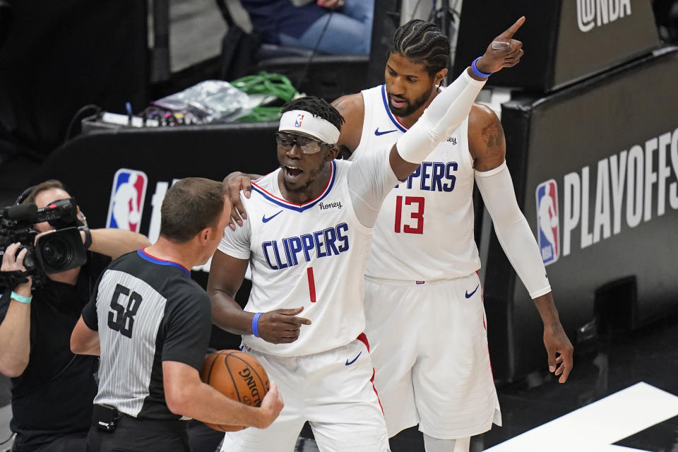 Los Angeles Clippers guard Reggie Jackson (1) argues with referee Josh Tiven (58) during the first half of Game 5 of the team's second-round NBA basketball playoff series against the Utah Jazz on Wednesday, June 16, 2021, in Salt Lake City. (AP Photo/Rick Bowmer)