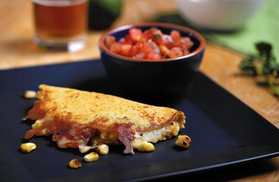 <p>Most people enjoy grilling corn and eating it straight from the cob, but roasted corn is also a great base for more involved dishes. This <a href="https://www.thedailymeal.com/cook/best-mexican-recipes?referrer=yahoo&category=beauty_food&include_utm=1&utm_medium=referral&utm_source=yahoo&utm_campaign=feed" rel="nofollow noopener" target="_blank" data-ylk="slk:Mexican recipe;elm:context_link;itc:0;sec:content-canvas" class="link ">Mexican recipe</a> uses corn in two ways. First, grill the corn and remove the kernels from the cob. Then, combine some of the kernels with masa harina to make your own tortillas. Place the rest of your roasted corn in between the tortilla with gooey Monterey Jack cheese and plenty of guacamole.</p> <p><a href="https://www.thedailymeal.com/recipes/roasted-corn-quesadilla?referrer=yahoo&category=beauty_food&include_utm=1&utm_medium=referral&utm_source=yahoo&utm_campaign=feed" rel="nofollow noopener" target="_blank" data-ylk="slk:For the Roasted Corn Quesadillas recipe, click here.;elm:context_link;itc:0;sec:content-canvas" class="link ">For the Roasted Corn Quesadillas recipe, click here.</a></p>