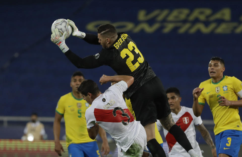 Brazil's goalkeeper Ederson catches the ball during a Copa America semifinal soccer match against Peru at Nilton Santos stadium in Rio de Janeiro, Brazil, Monday, July 5, 2021. (AP Photo/Silvia Izquierdo)