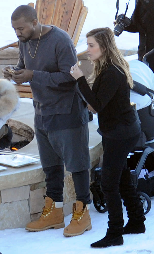 Kanye and Kim eat s'mores. (Photo: Splash News)