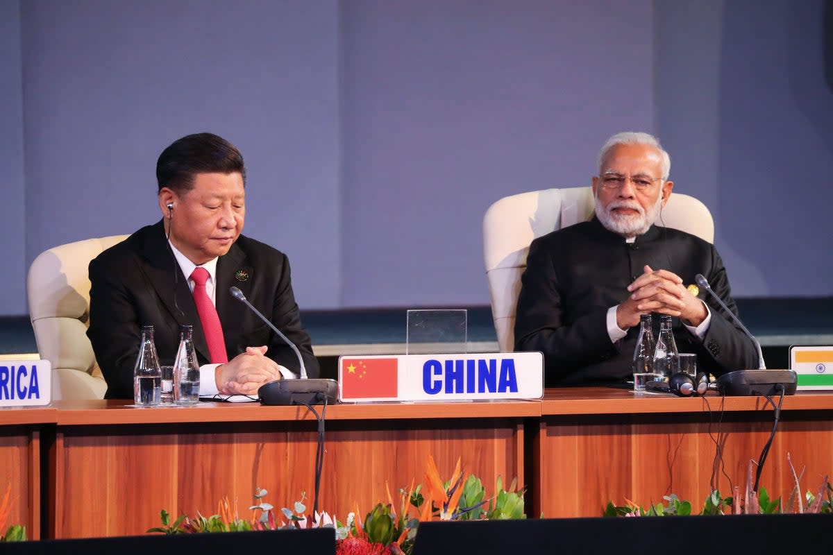 China’s president Xi Jinping and India’s Prime Minister Narendra Modi attend a session meeting during the 10th BRICS summit in 2018  (AFP via Getty Images)