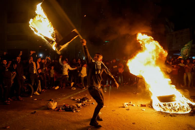 Palestinians celebrate following Jerusalem's shooting attack, in Gaza City