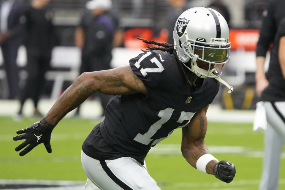 FILE - Las Vegas Raiders wide receiver Davante Adams (17) warms up before an NFL preseason football game against the Minnesota Vikings on Aug. 14, 2022, in Las Vegas. Davante Adams, Tyreek Hill, A.J. Brown, Super Bowl MVP Cooper Kupp and even Christian Kirk are among the wide receivers who reset the market for just how well the NFL pays the best at that position this year. Now comes the tough part: Proving they're worth all those millions and millions of dollars. (AP Photo/Rick Scuteri, File)