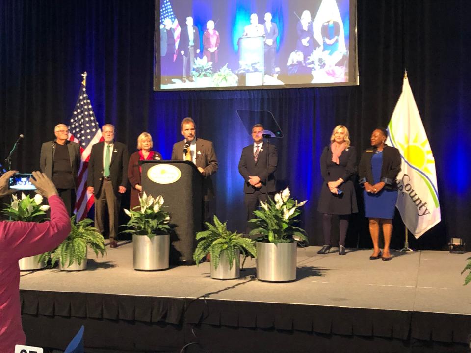 Next week the Volusia County Council will take a final vote on its new budget and property tax rates. The Council is pictured standing together on the Ocean Center stage. Council members are, from left, Fred Lowry, Ben Johnson, Billie Wheeler, County Chair Jeff Brower, Danny Robins, Heather Post and Barb Girtman.