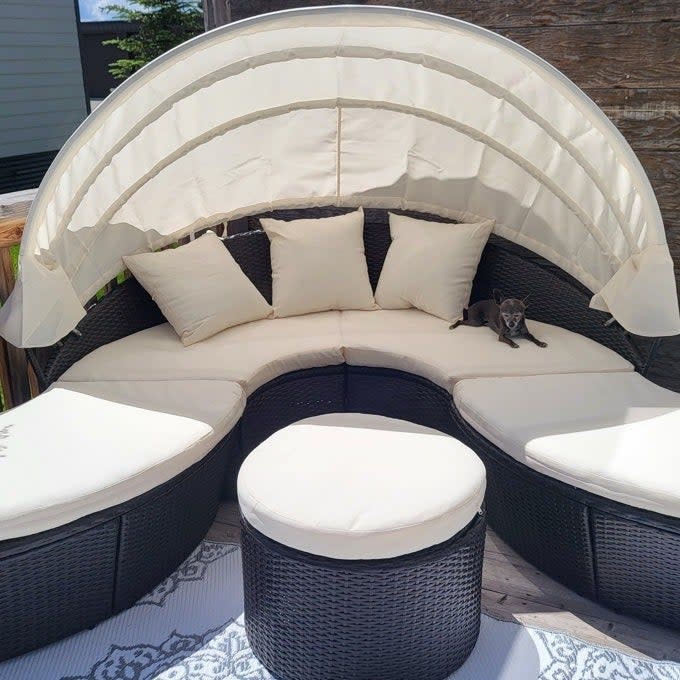 a reviewer photo of the white daybed arranged into a couch with ottoman