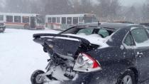 One of about a dozen mangled cars await processing after a 20-vehicle pileup on the Queen Elizabeth Expressway on Saturday.