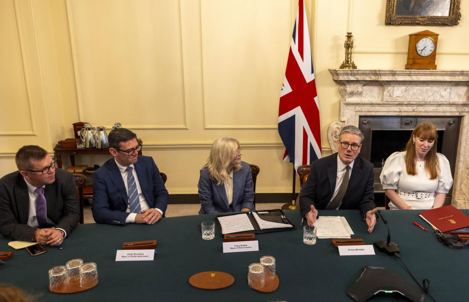 Britain's Prime Minister Keir Starmer hosts the first roundtable with regional UK mayors, at Downing Street, in London, Tuesday, July 9, 2024. Seated from left are Mayor of Cambridgeshire and Peterborough Nik Johnson, Mayor of Greater Manchester Andy Burnham, Mayor of West Yorkshire and Tracy Brabin and Deputy Prime Minister Angela Rayner. (Ian Vogler, Pool Photo via AP)