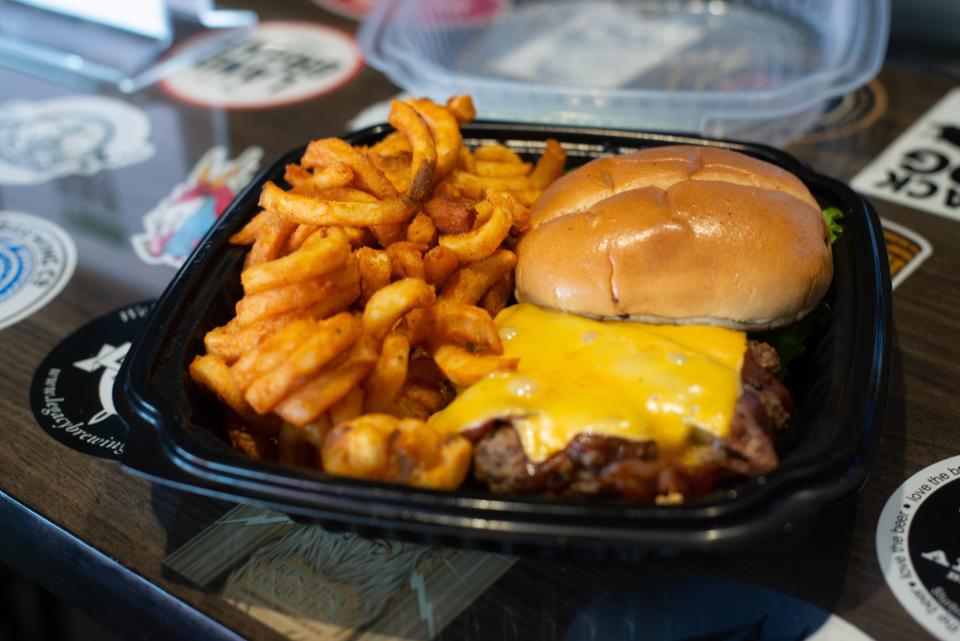 The Wagon Wheel burger at Jeremiah Bullfrogs comes with hickory sauce brushed onto the patty and is topped with bacon and American cheese.