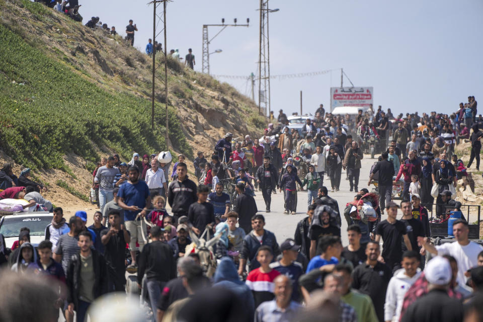 Displaced Palestinians trying to walk back from central Gaza Strip to northern Gaza Strip , Sunday, April 14, 2024. (AP Photo/Abdel Kareem Hana)