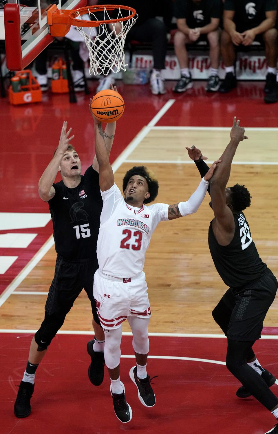 Wisconsin guard Chucky Hepburn (23) out rebounds Michigan State center Carson Cooper (15) during the first half of their game Friday, January 26, 2024 at the Kohl Center in Madison, Wisconsin.